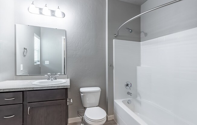 a bathroom with a toilet sink and bathtub