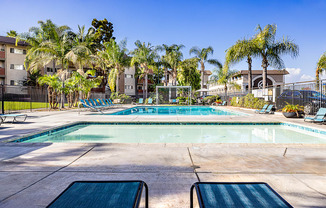 Ocean Breeze Villas Pool with Lounge Chairs