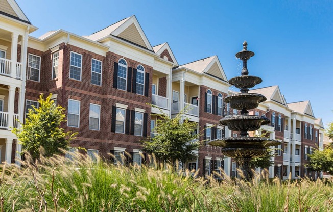 Exterior Shot of Buildings with Outdoor Fountain at Alexandria of Carmel Apartments, Carmel, IN