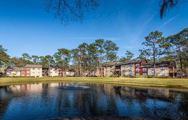 Lake view with exterior building at Northlake Apartments, Jacksonville FL