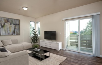 a living room with a couch and a coffee table and a television