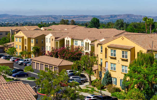 A residential area with houses and cars.