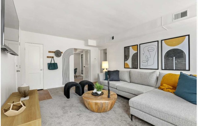 Spacious living room with sectional sofa at Donnybrook Apartments, Maryland, 21286