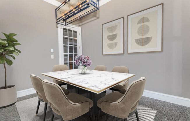 a dining room with a marble table and chairs