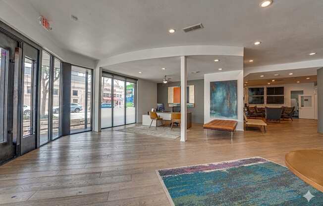 Spacious lobby with modern seating and artwork at Vue Live Oak Apartments, Dallas, TX 75204