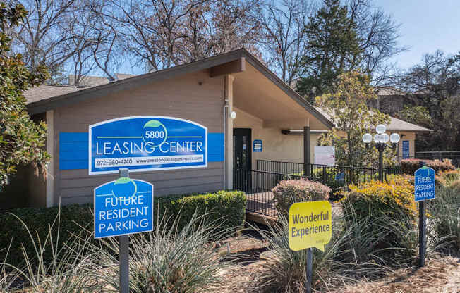 A leasing center with a sign that says "Future Resident Parking" and "Wonderful Experience".