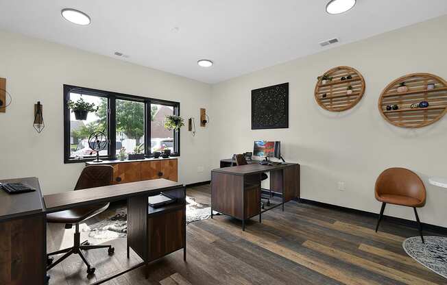 an office with two desks and two chairs