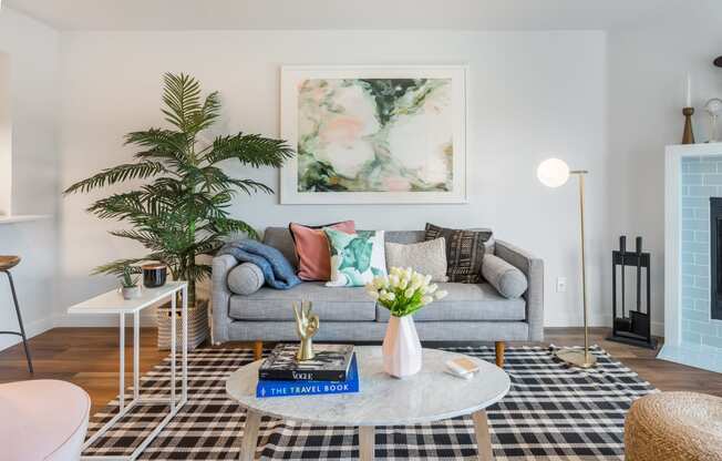 a living room with a gray couch and a coffee table