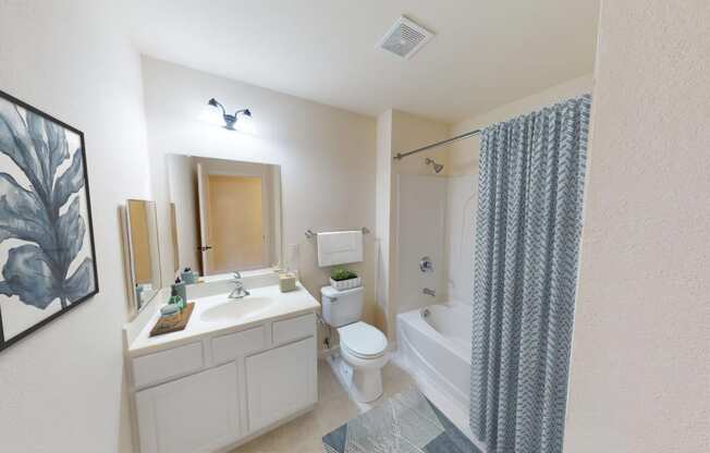 a bathroom with a sink toilet and a bath tub