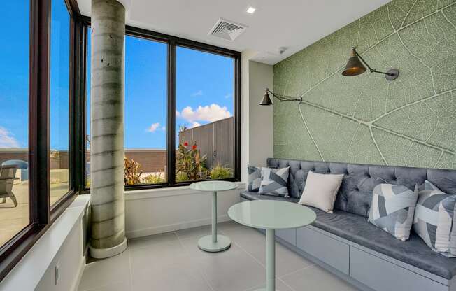a living room with a couch and two tables