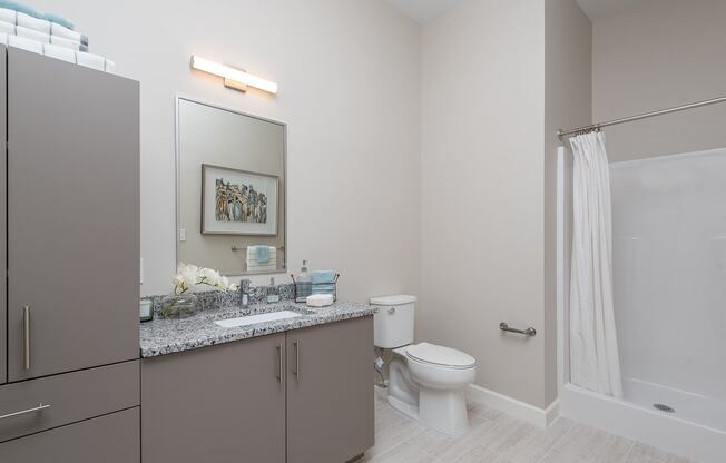 Bathroom with a huge amount of storage in the apartments at One Wall St