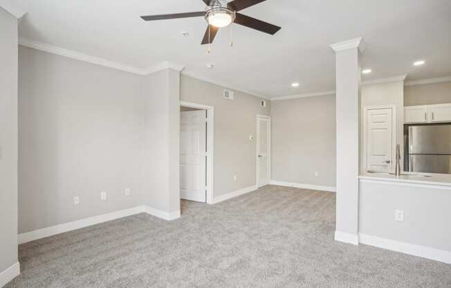 an empty living room with a ceiling fan  at The Verandah, Austin, TX, 78726