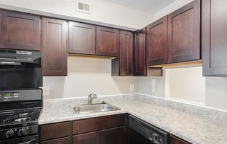 a kitchen with a sink and a stove