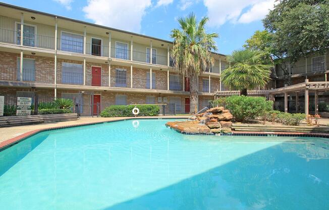 a large pool of water in front of a building