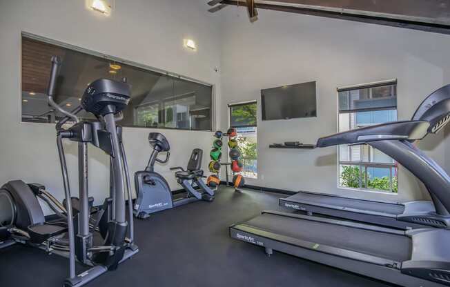 Gym with cardio equipment at Foster Creek apartments south of Seattle