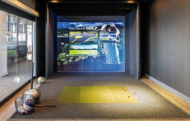 3thirty3 new rochelle ny apartment high rise photo of sports simulator with golf clubs and golf balls as well as other sports equipment