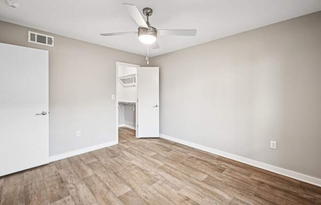 Serene bedroom area in the D5 floor plan at Windridge On The Parkway Apartments in Dallas, TX