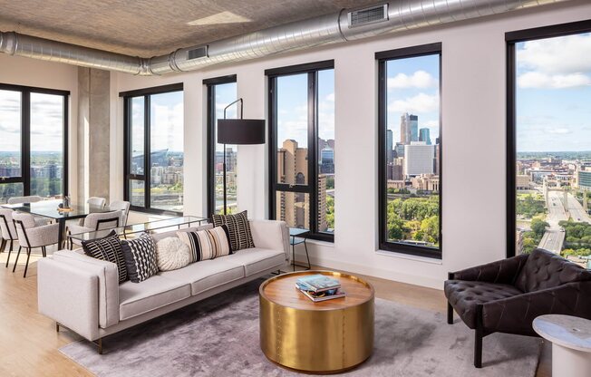 Penthouse living and dining room with view of downtown minneapolis