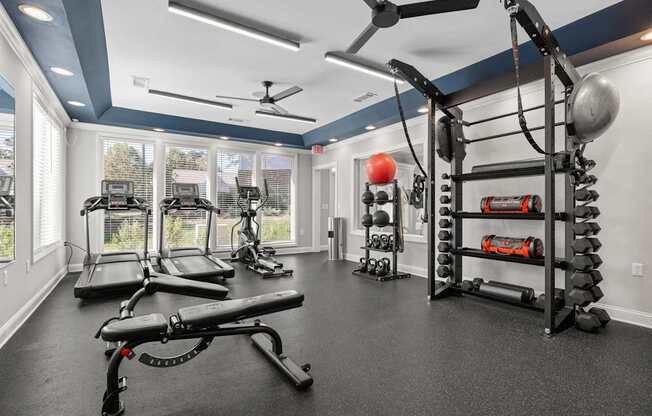 A spacious home gym with a variety of exercise equipment.