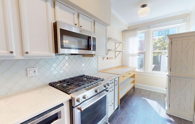 Spacious Three Bedroom Home W/Backyard, Back Deck, Front Porch, & Garage Parking