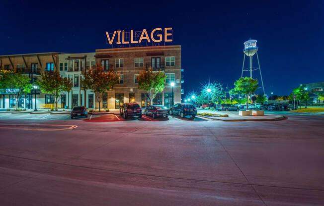 Photo of outside of Village of Rowletts building showing Village sign lit up.