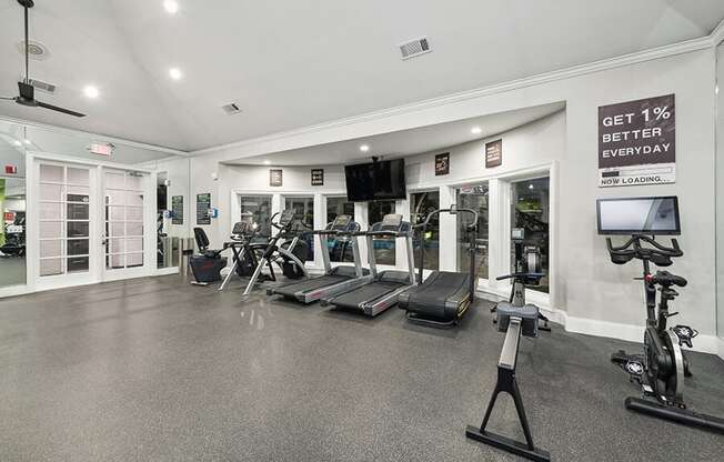 Community Fitness Center with Equipment at Bridges at Oakbend Apartments located in Lewisville, TX.