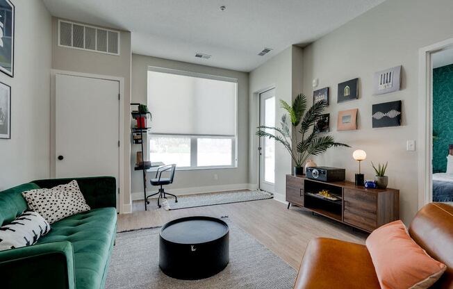 a living room with a green couch