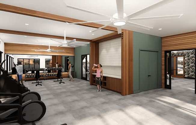 A woman is stretching in a spacious room with exercise equipment.