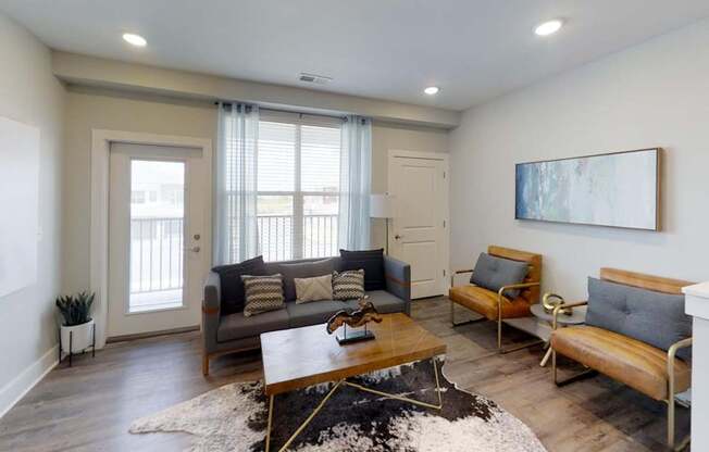 a living room with couches and a coffee table at Echo Park at Perry Crossing Apartments, Indiana