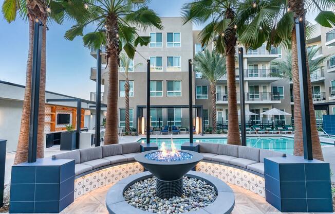 Modera Pomona features a fire pit near the pool, perfect for relaxing and enjoying the outdoors.