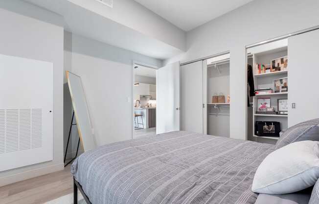 Bedroom with queen bed at TREO Apartments, Ohio