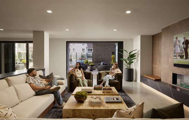 A group of people are sitting in a modern living room.