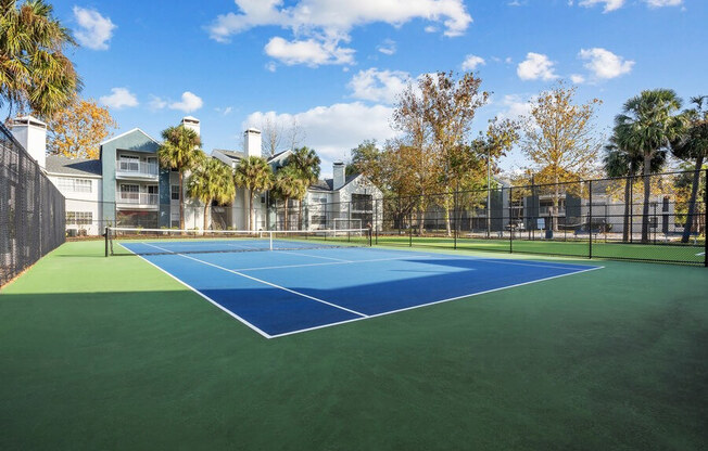 Outdoor Tennis and Pickleball Court at Caribbean Breeze Apartments in Tampa, FL.