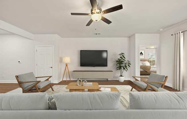 a living room with a couch and a ceiling fan