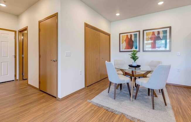 a dining room with a table and chairs