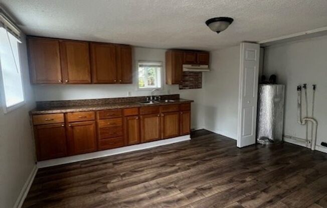 Charming 2BR Home with Large Front Porch & Spacious Kitchen