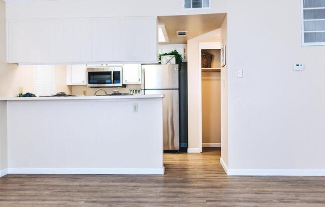 a kitchen with a stove and a refrigerator