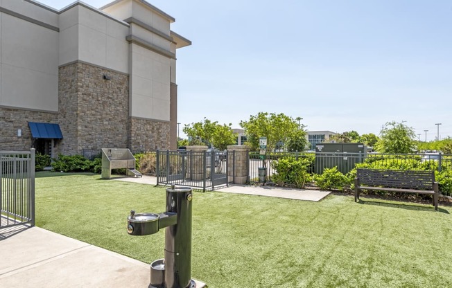 the preserve at ballantyne commons courtyard with grass and a bench