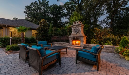 a backyard patio with chairs and a fireplaceat Echo at Lake Norman, North Carolina