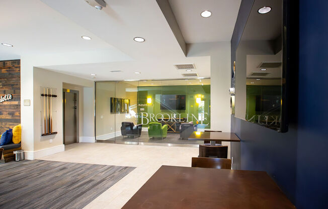 a conference room with a table and a glass door