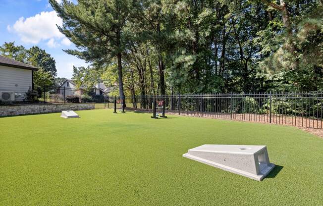 a yard with a pool and a fence and trees at View at Lake Lynn, Raleigh, NC