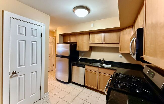 Pristine 2 Bedroom, 1 Bathroom Condo Available NOW! Heat, Water, & Parking INCLUDED in Rent!