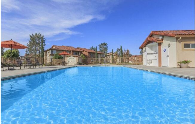 a large swimming pool with houses in the background at Riverview Springs, Oceanside