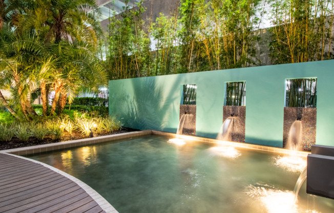 Waterfall surrounded by gorgeous landscaping in zen garden for residents of Millenia 700