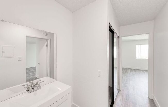 a bathroom with a sink and a mirror