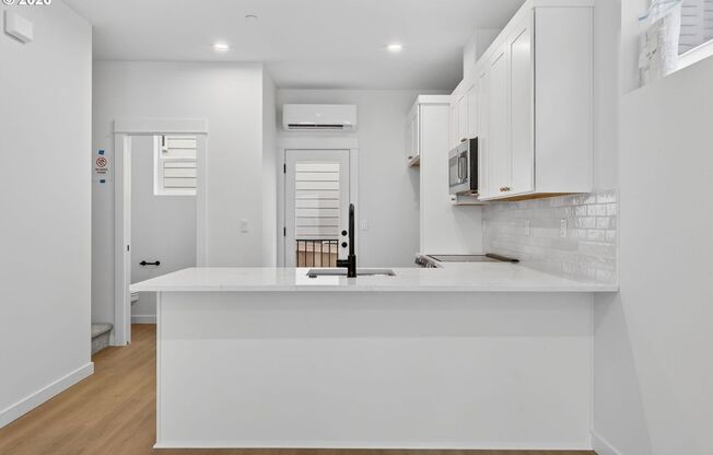 Brand-New 2-Bedroom Home with White Granite Kitchen, Open-Concept Living & Attached Garage