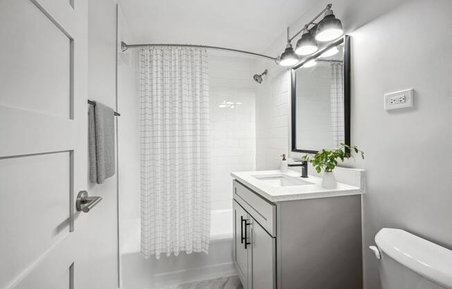 a bathroom with a sink and a shower