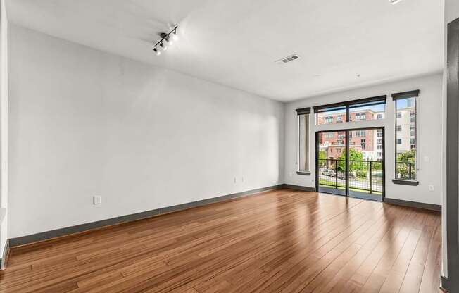 A room with wooden floors and white walls.