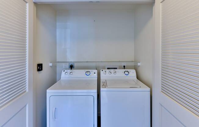 laundry closet with washer and dryer at Capriana at Chino Hills, California