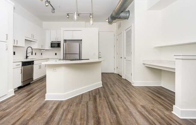 a kitchen and dining area in a 555 waverly unit